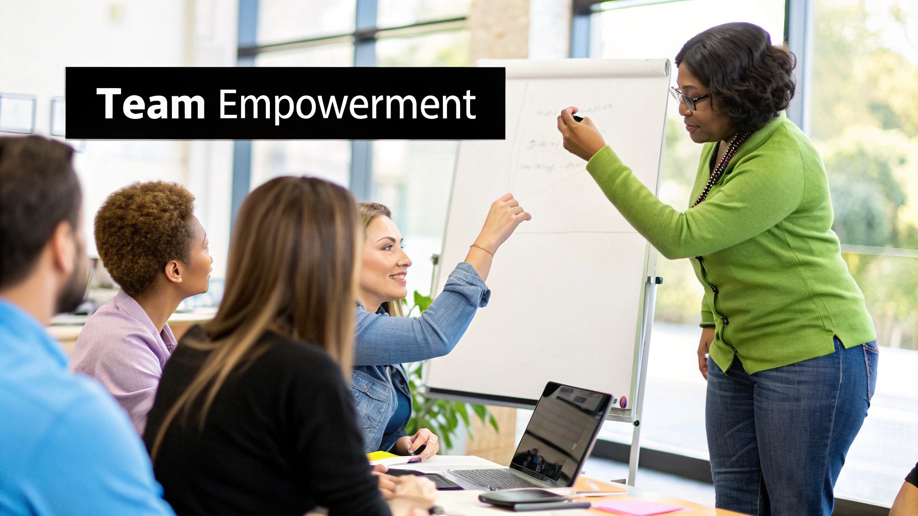 Team members collaborating and supporting each other in an office.