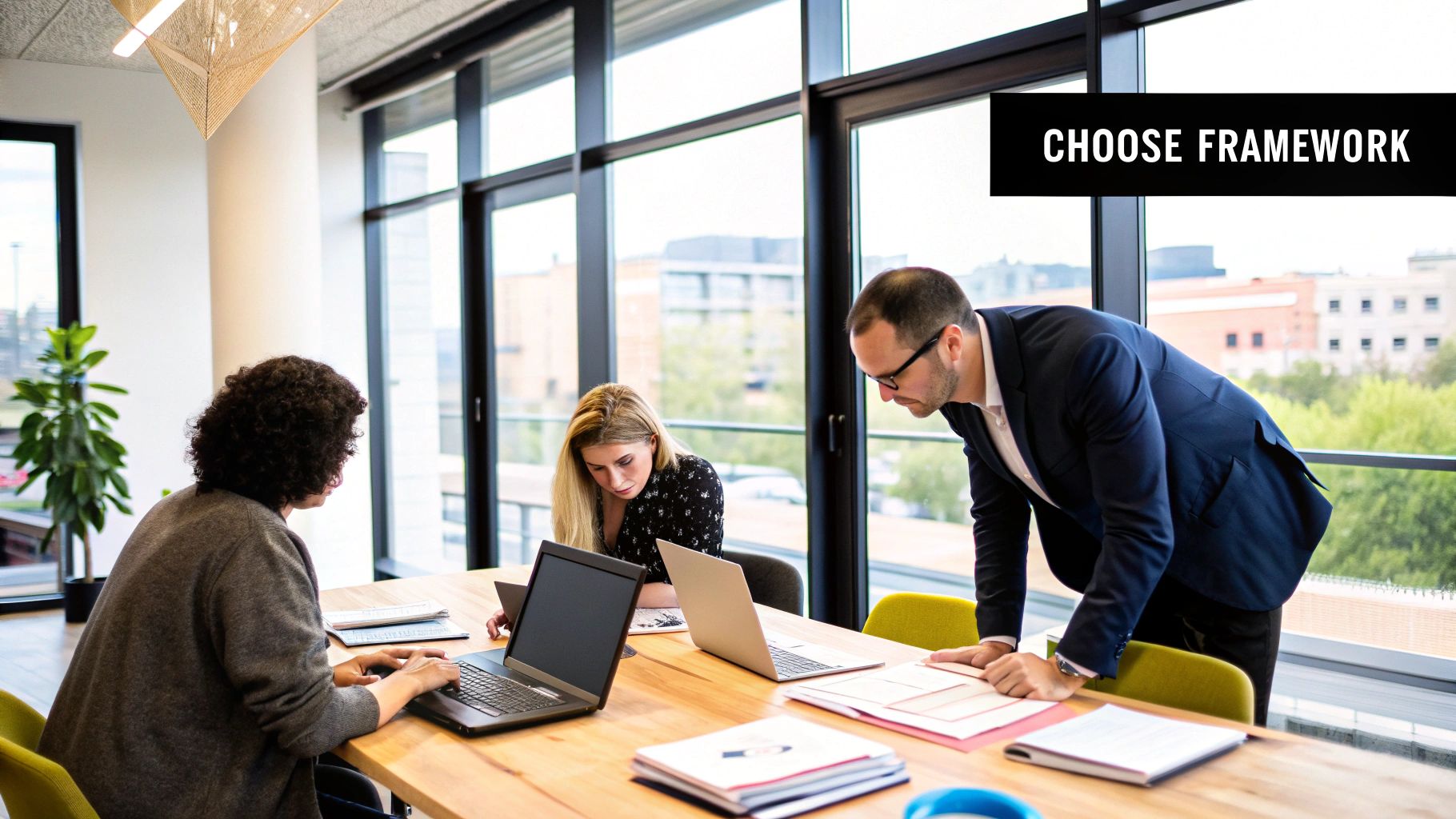 Project managers discussing different methodologies around a table.