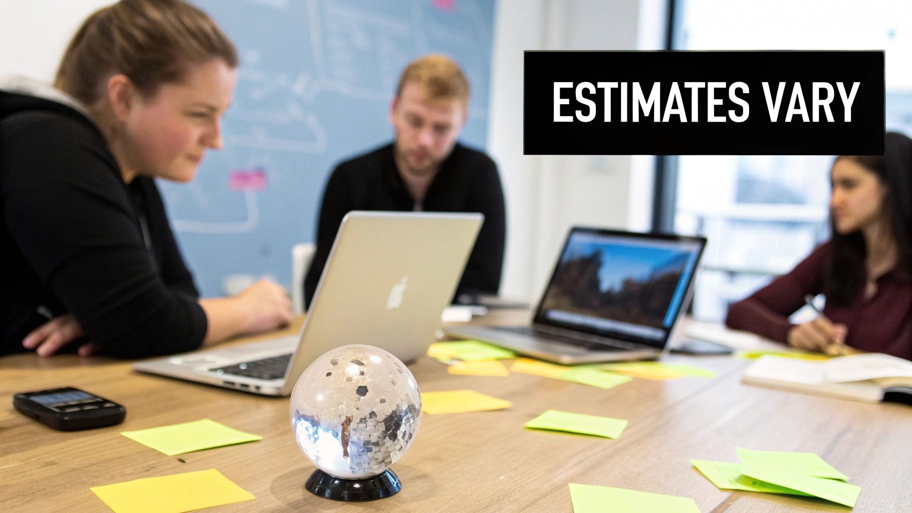 Three colleagues working around a table with laptops, notes, and an 'ESTIMATES VARY' sign.