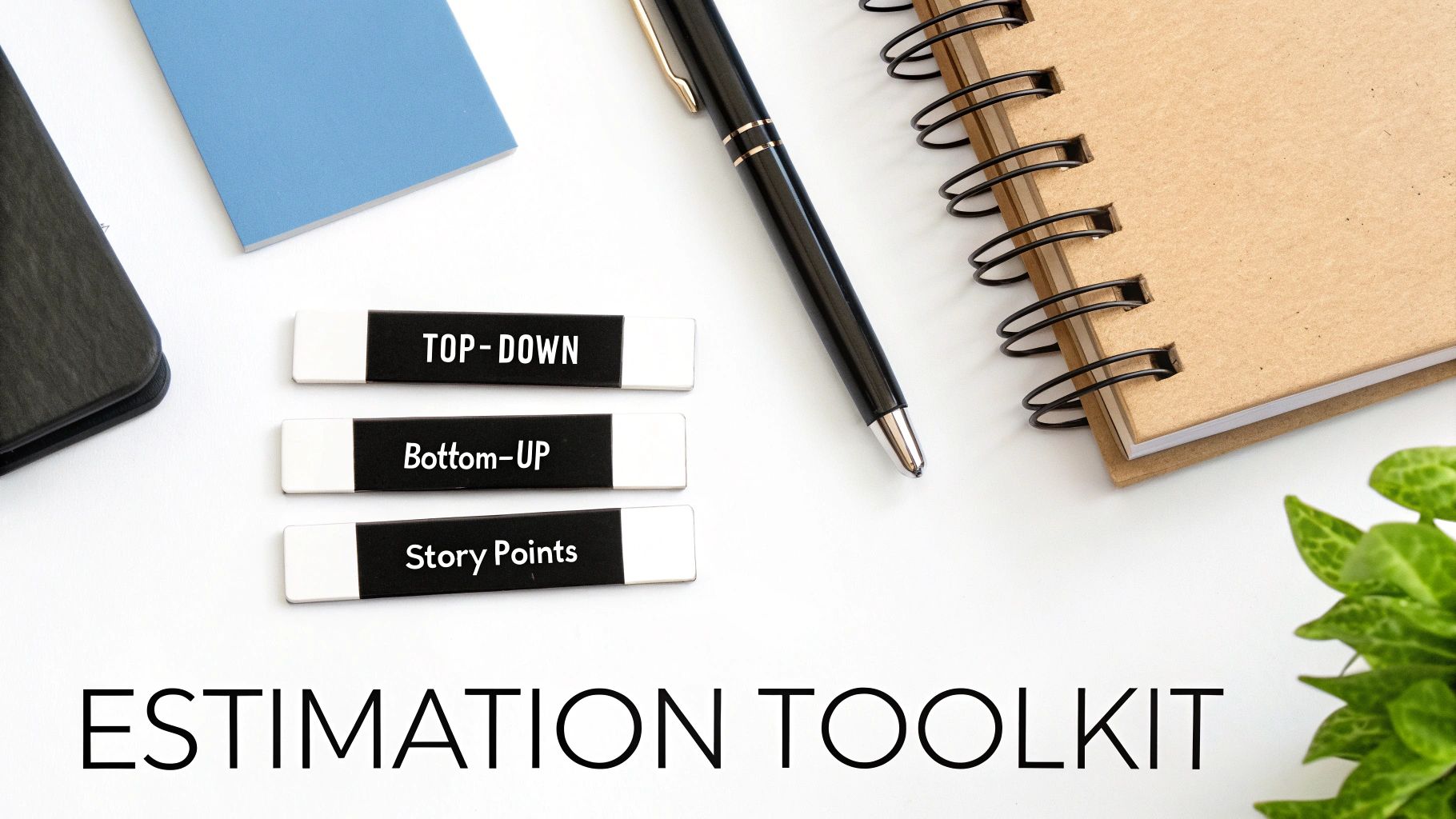 A desk with labels showing 'Top-Down', 'Bottom-UP', 'Story Points' and 'Estimation Toolkit' text.