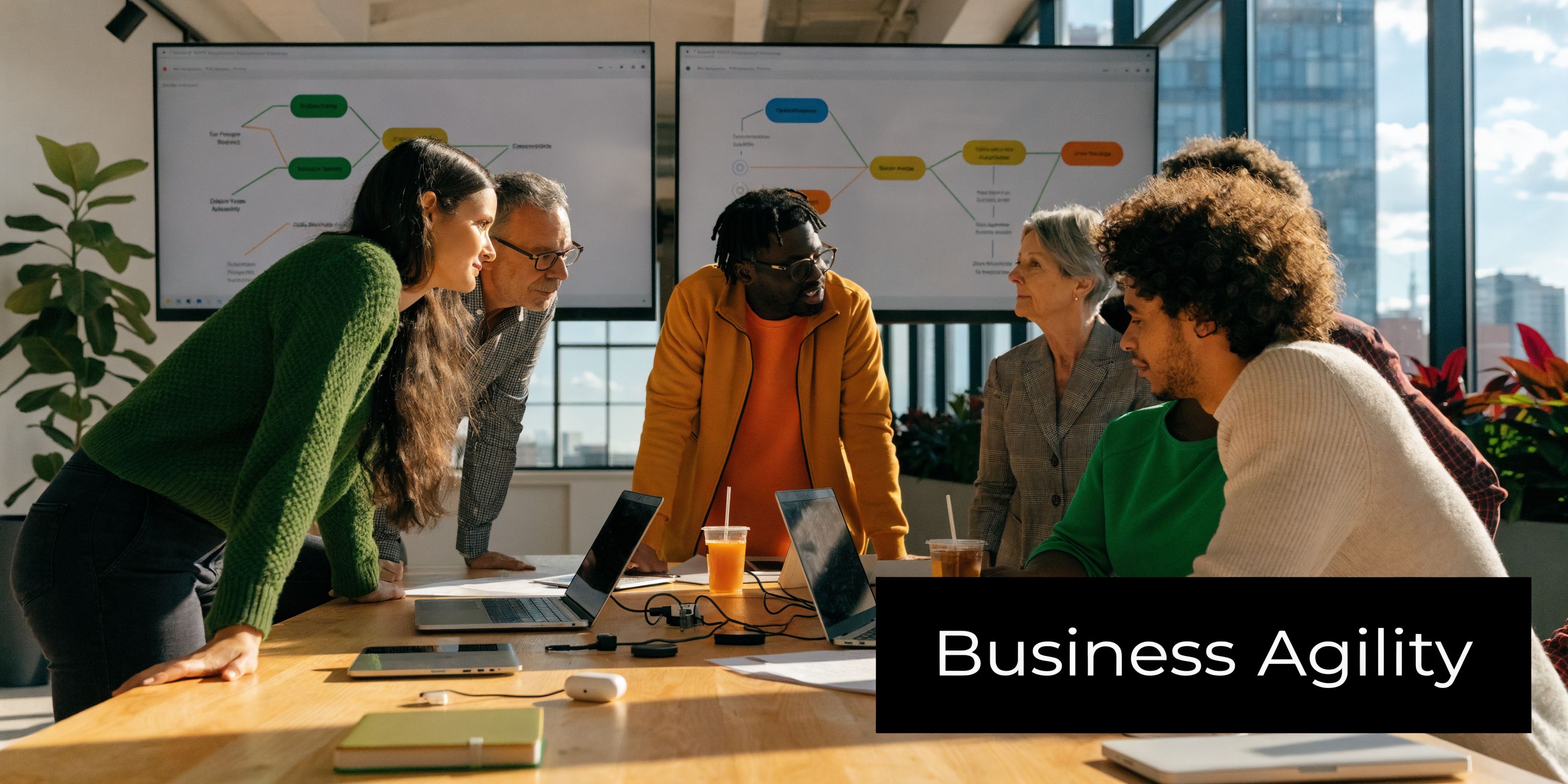 A diverse team of professionals collaborating around a conference table during a strategy meeting in an office.