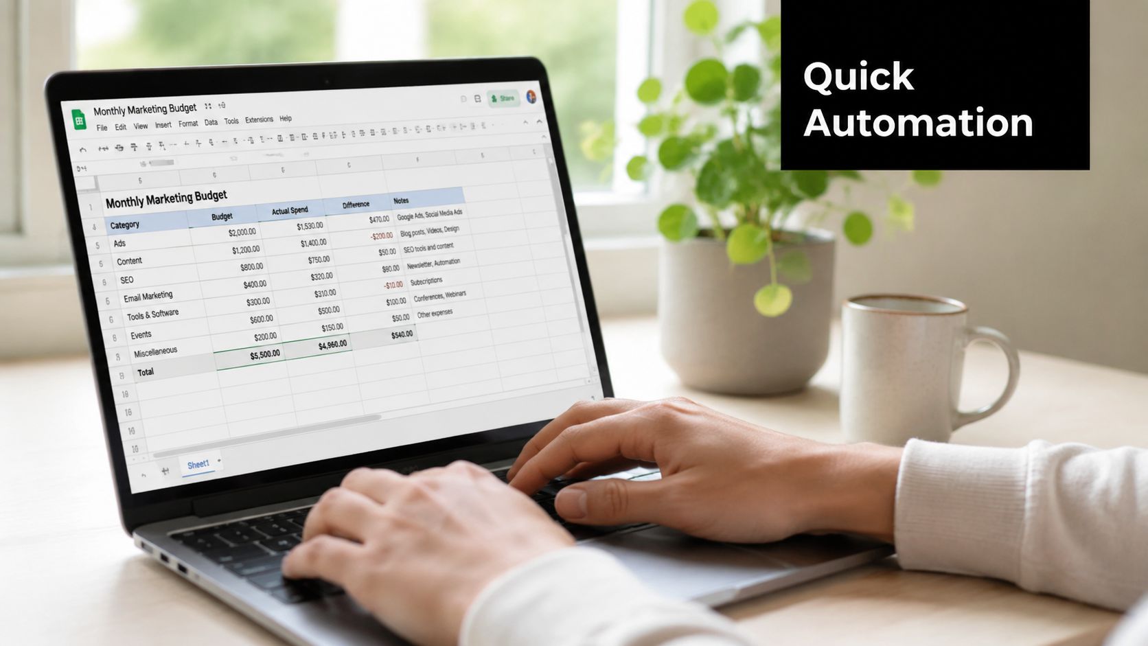 A person using a laptop to manage a monthly marketing budget spreadsheet for business finance planning.