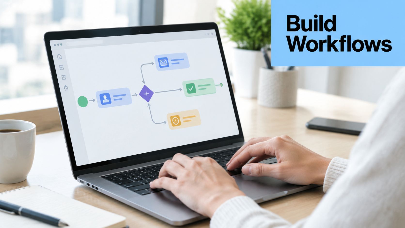 A person working on a laptop displaying a visual marketing automation workflow diagram on the screen.
